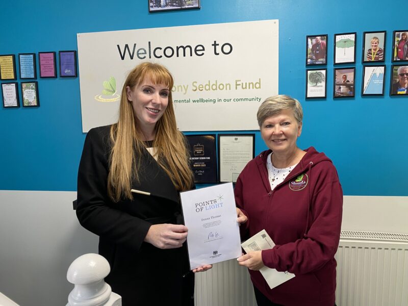 Angela presents Donna with her award