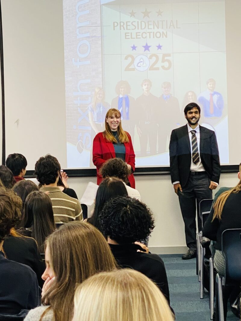 Angela congratulates the new President, Ayaan Naveed